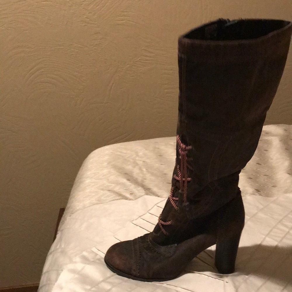 High heel boots. Laces in front zips up on side